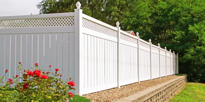 Comparison of vinyl fence with other types of fences in a backyard setting